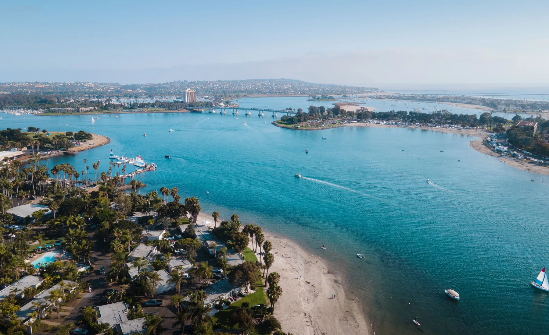Aerial drone view of a coastal city and marina — Sonder Consulting AI and business solutions